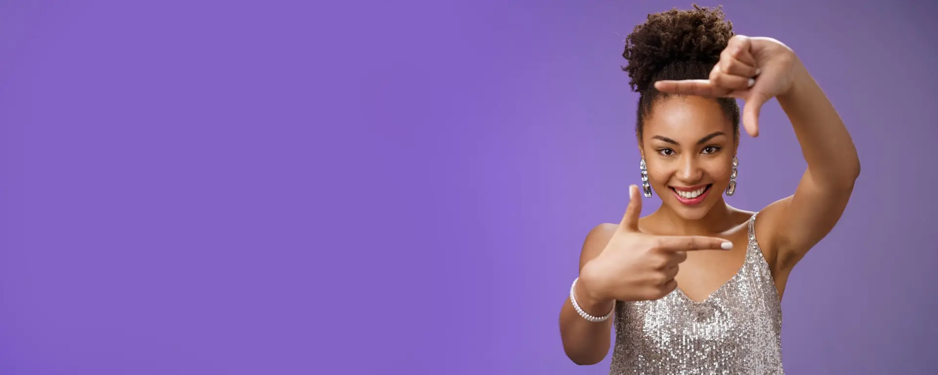Elegant attractive happy creative african american girl in silver shiny dress make finger frames smiling through it search inspiration looking confident found perfect angle design idea, spot goal.